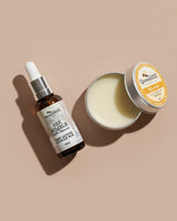 Bee product set with a dropper bottle and a jar on a beige background