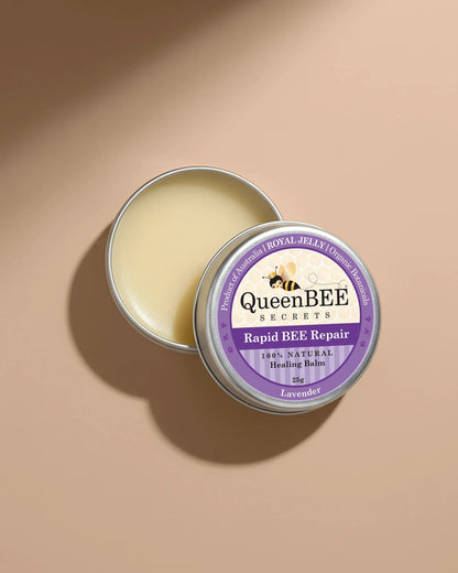 QueenBEE Secrets Rapid BEE Repair balm in a tin on a beige background