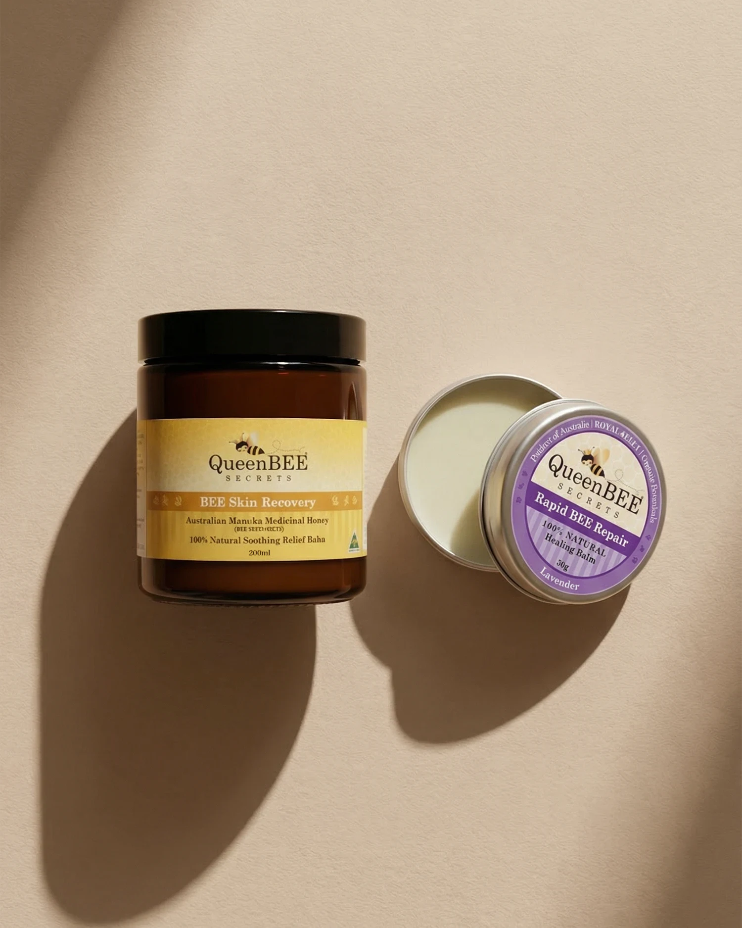 Two QueenBEE products on a beige background